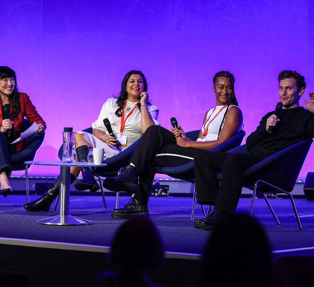 Travel content creators on stage at The TravMedia Summit 2026